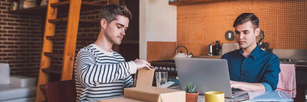 What Small Businesses Need to Know About the Internet of Things (IoT) Two men hard at work for their small at-home business