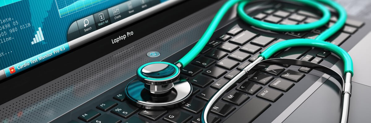 Image of stethoscope resting on top of laptop keyboard
