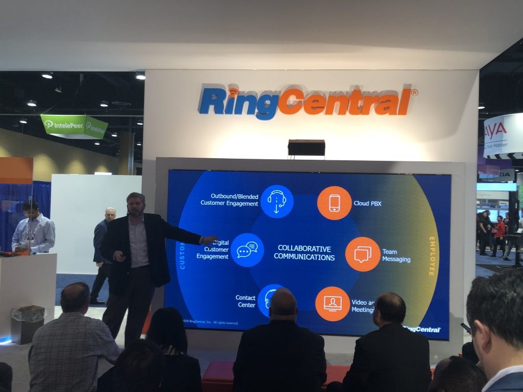 Group of employees in front of RingCentral booth