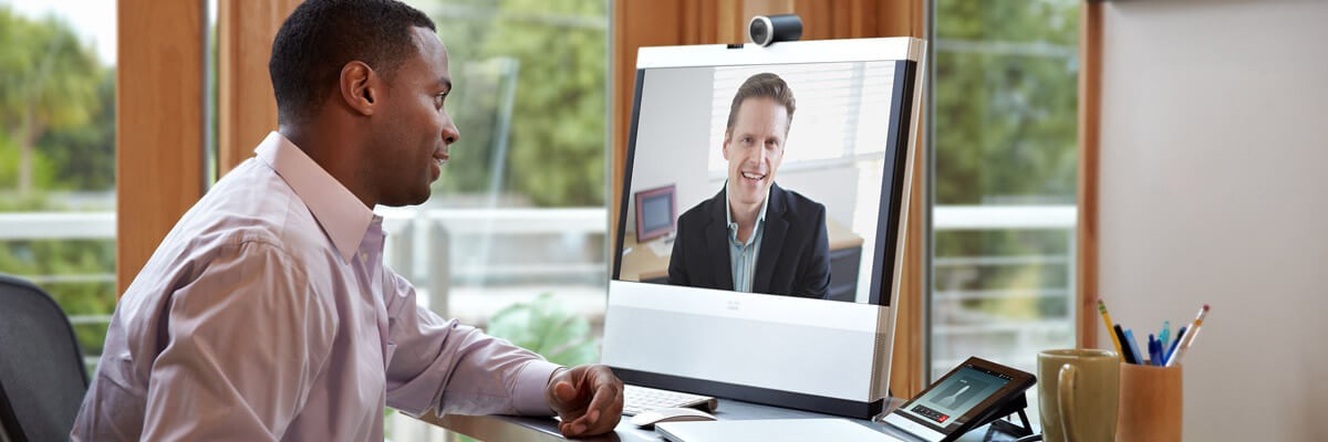 Two business professionals have a webex meeting using video