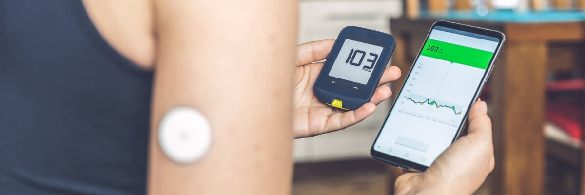 Comparing glucose levels with traditional glucometer and with smart phone reading from remote sensor mounted to forehand. Healthcare IoT, why the internet of medical things is the future of healthcare, internet of medical things, future of healthcare, how the IoT is used in healthcare