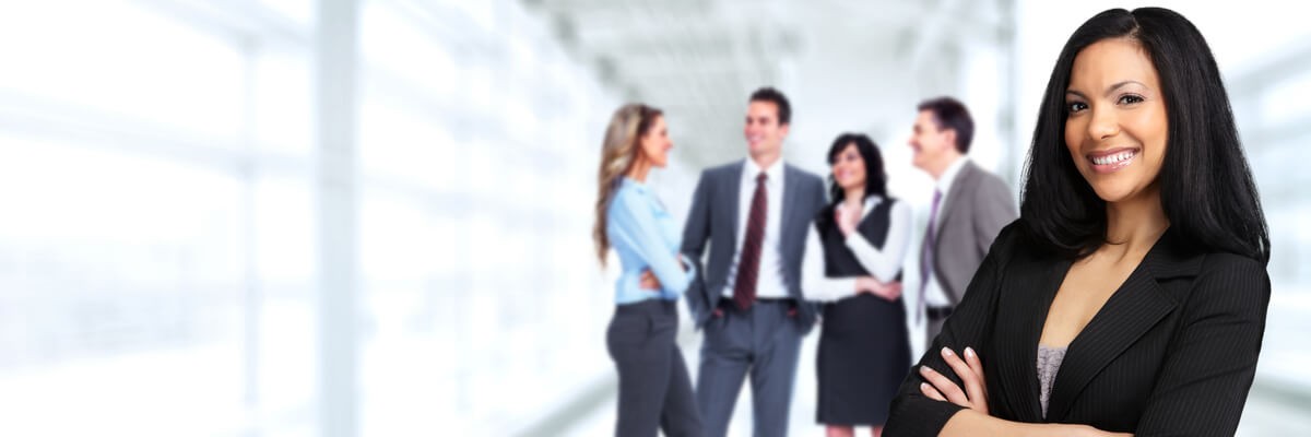 Selecting and Outsourcing the Right Microsoft Services A businesswoman smiling and posing