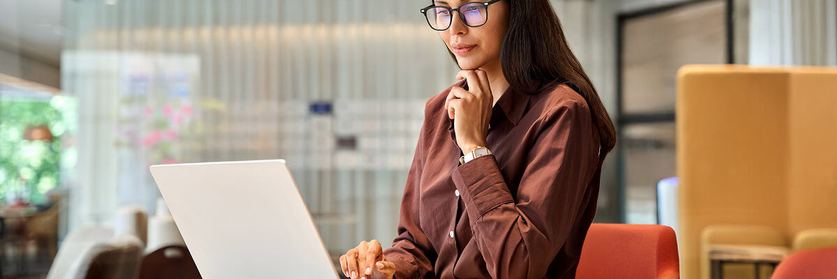 Enterprise Device Refresh Planning: August Market Update Girl working on a laptop.