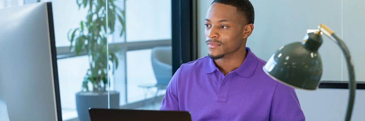 Man typing on computer