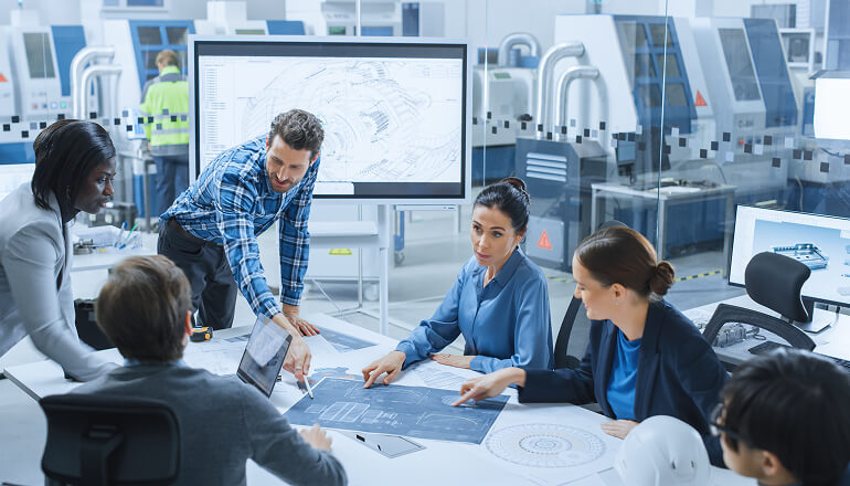Guy in meeting talking to a group of people