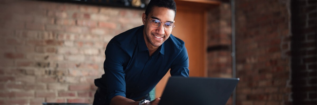 The Pros and Cons of Software as a Service Business professional reviewing software licensing options. SaaS, Software as a Service.