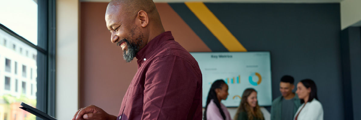 The Chatbot Era Is Over: How Google I/O 2026 Just Unlocked True Agentic AI Man using a tablet smiling