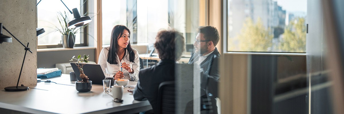 How Workplace Services Help Your Business Power Modern Work Teammates collaborating around laptop