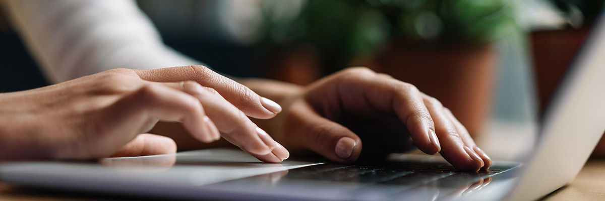 User typing on keyboard