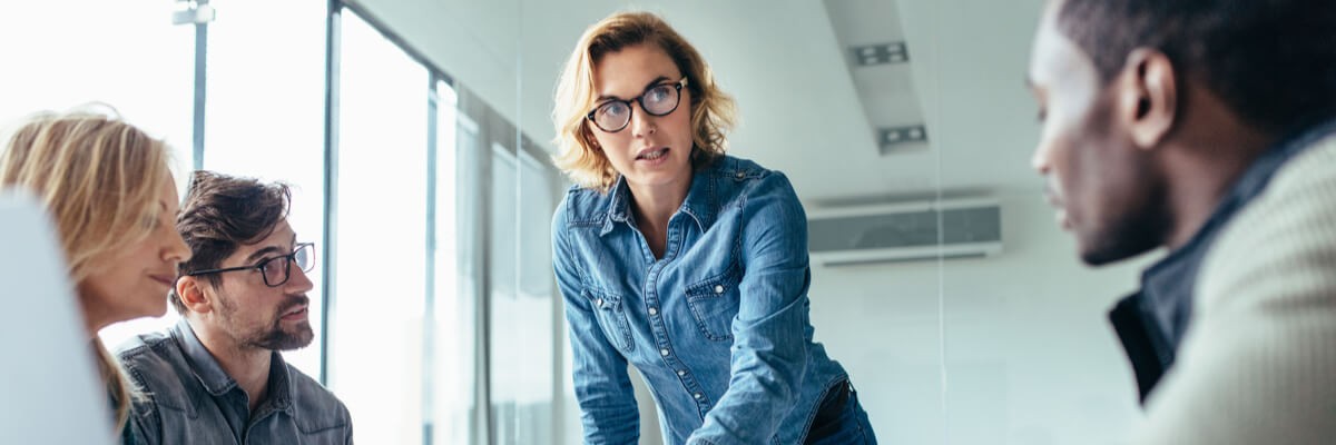 Let’s dig deeper into the purpose of these artifacts and their differences. Team discussing project plan