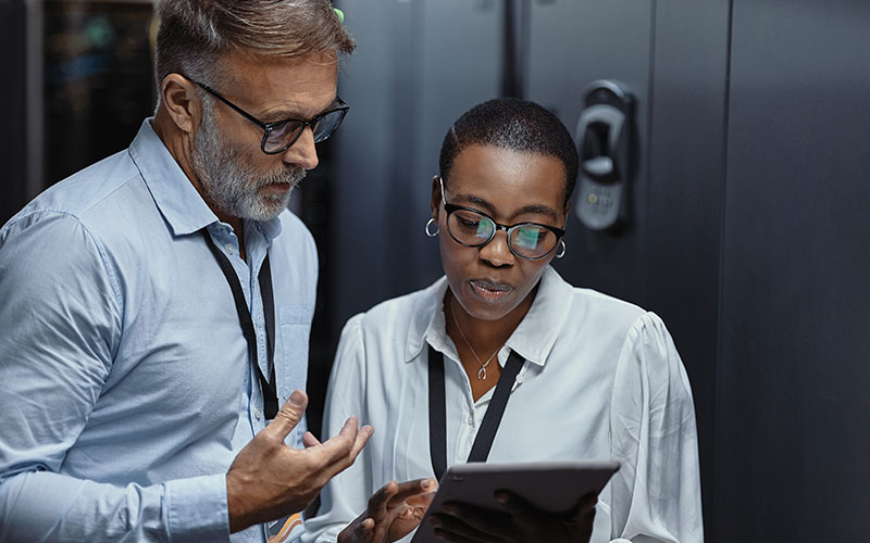 People on tablet in a data center