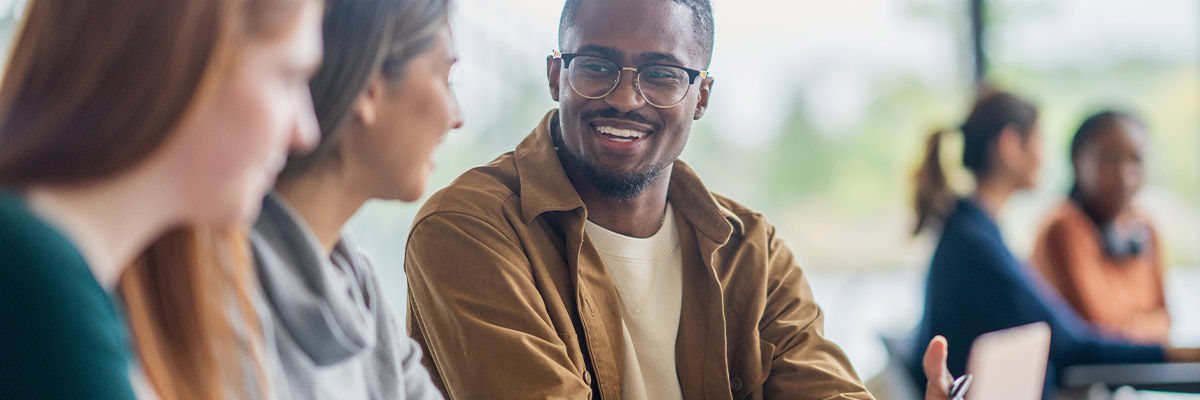 Build Successful LLM Apps by Leading With Evaluations College students talking in class