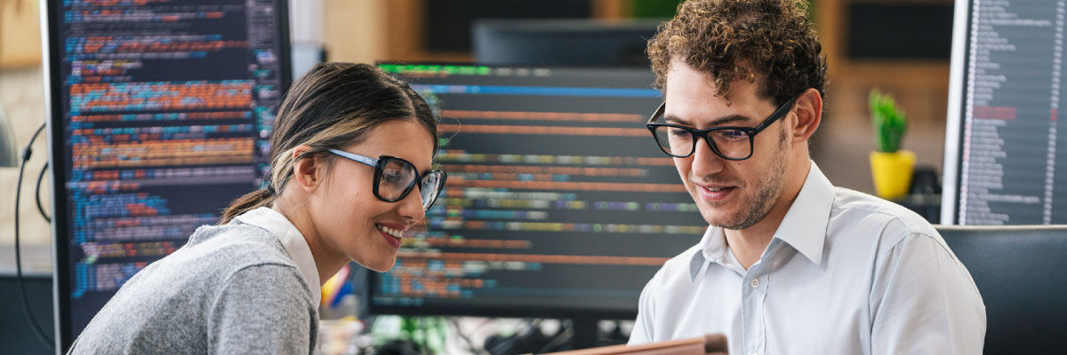 Man and woman looking at data on a device