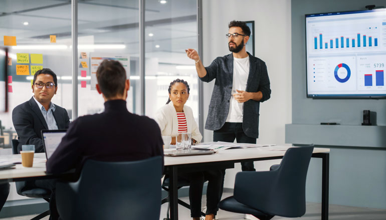 Person talking in a meeting.