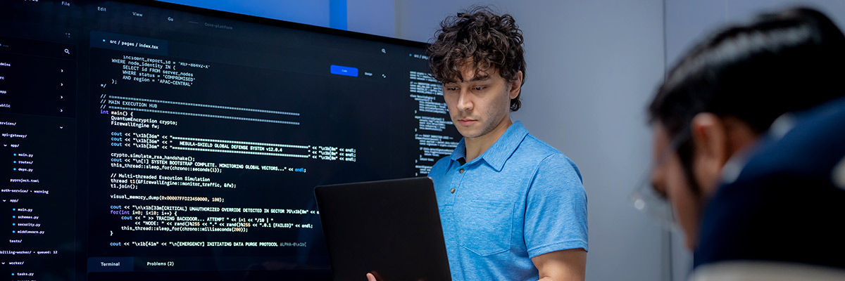 Male developers working on code