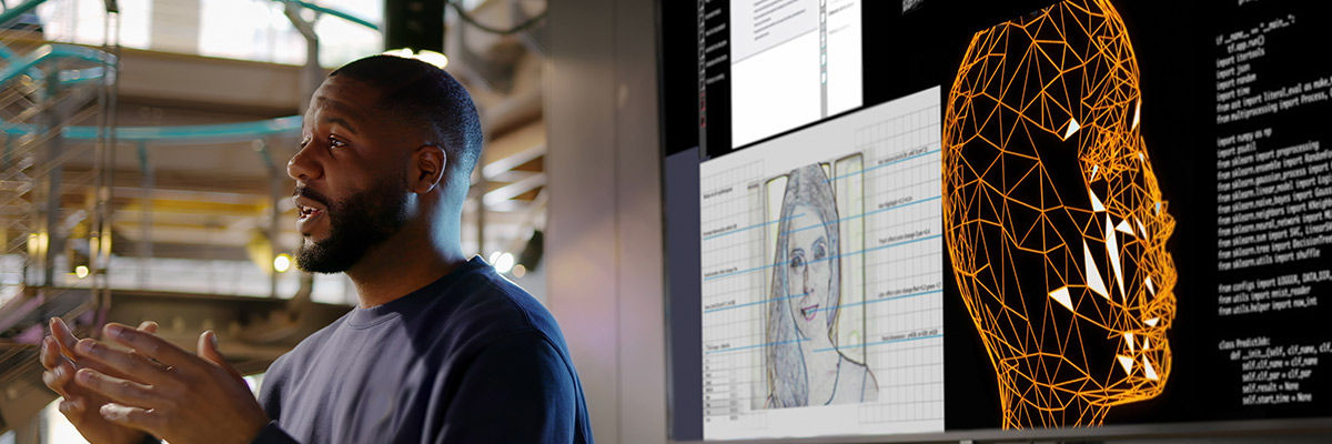 Developers discussing around work desks