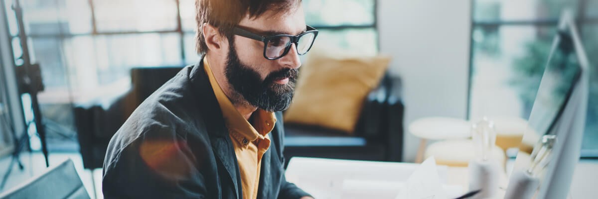 User using computer device with Adobe Acrobat Pro and Microsoft 365 Apps