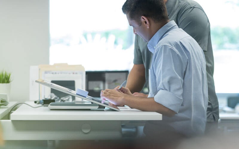 two people collaborating in an office