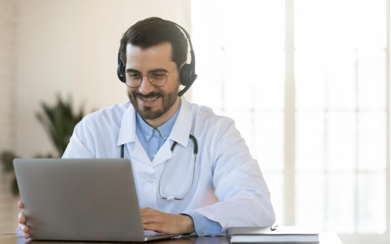 Doctor working on laptop device