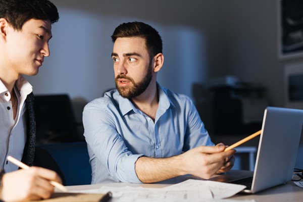 Achieve data center optimization with minimal risk IT professional explaining process to colleague