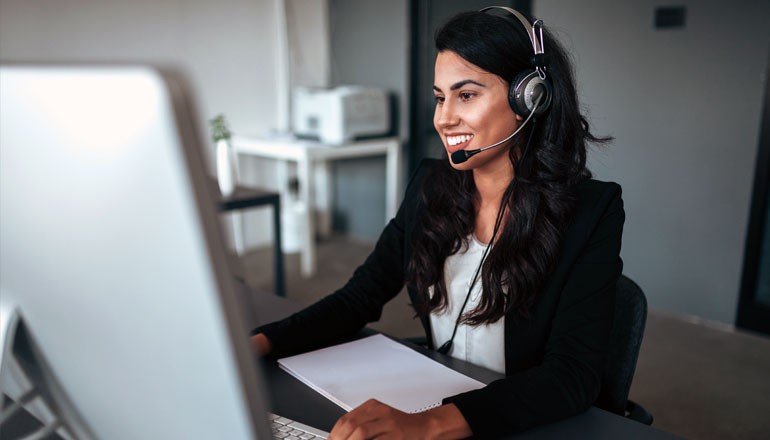 Businesswoman with headset works from home 
