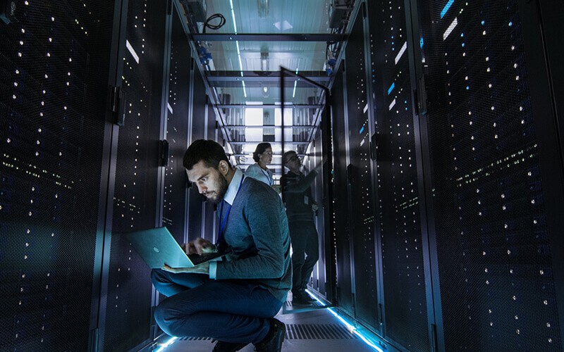 Business professional reading whitepaper off of tablet computer