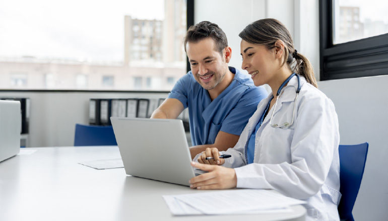 Doctor and nurse working on a computer together
