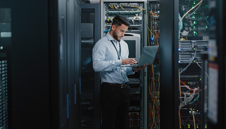 Guy working in data room