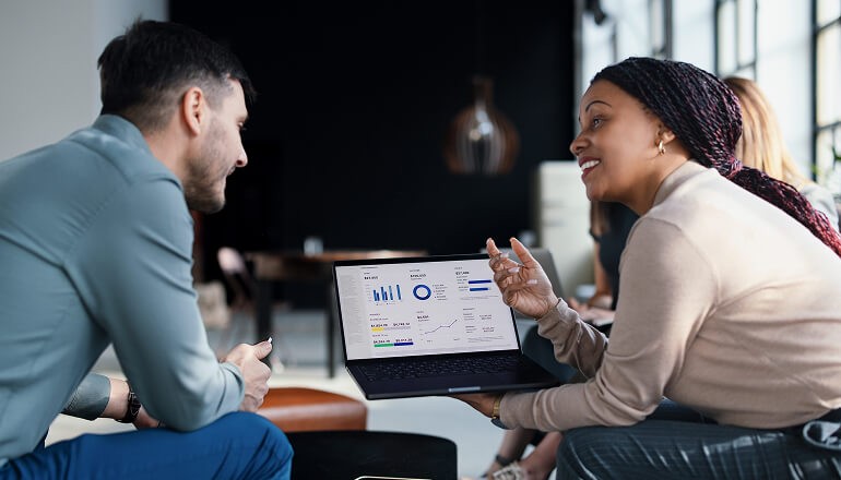 People looking at data on laptop