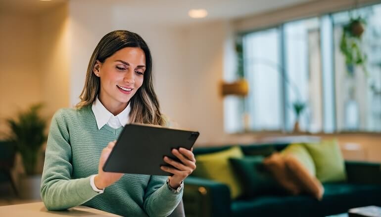 Dun & Bradstreet builds a global network powerhouse on Google Cloud girl on a tablet