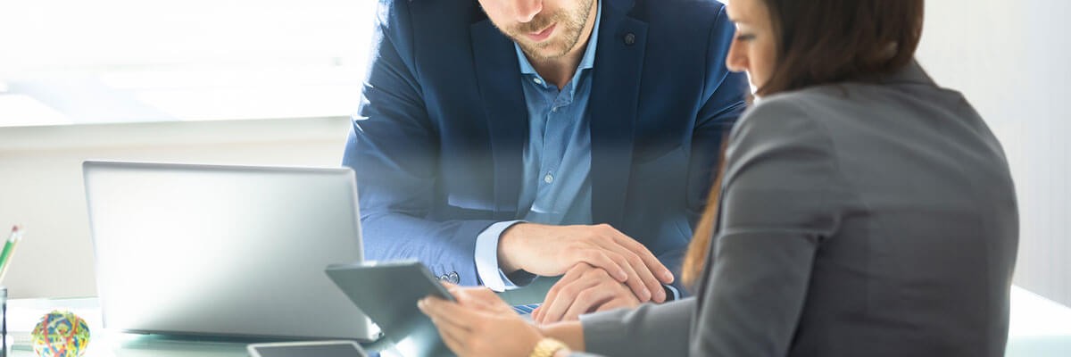 Financial institution representatives discussing device services, device management, supply chain optimization, device refresh, endpoint management