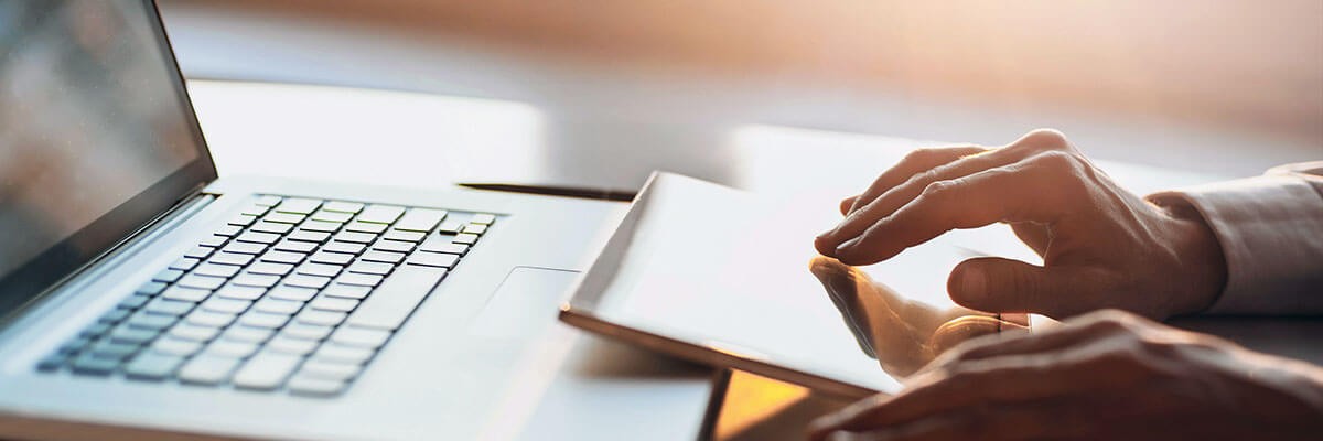 Hands typing on keyboard. Device services, procurement, mobility support, Windows 10, imaging, break-fix, device lifecycle management