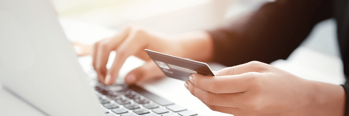 Global Enterprise Takes Control of Software Assets Close up of online purchase being made on laptop with credit card