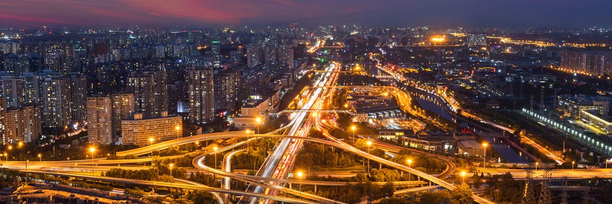 Bird's eye view of city and highways at night