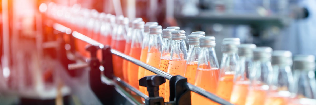 Close up view of bottles on a conveyor belt