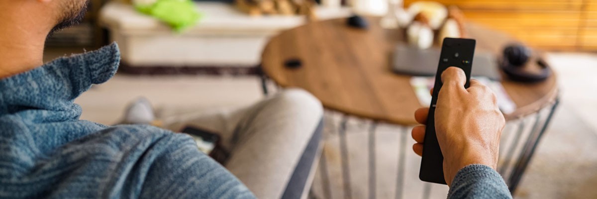 Man watching content from a leading media corporation