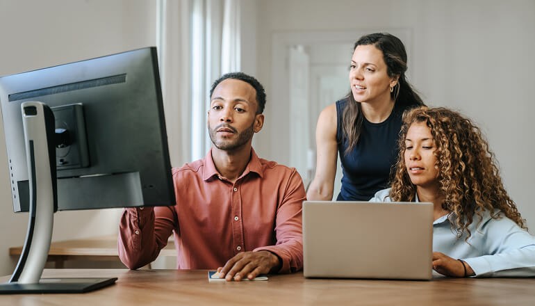 People looking at computer