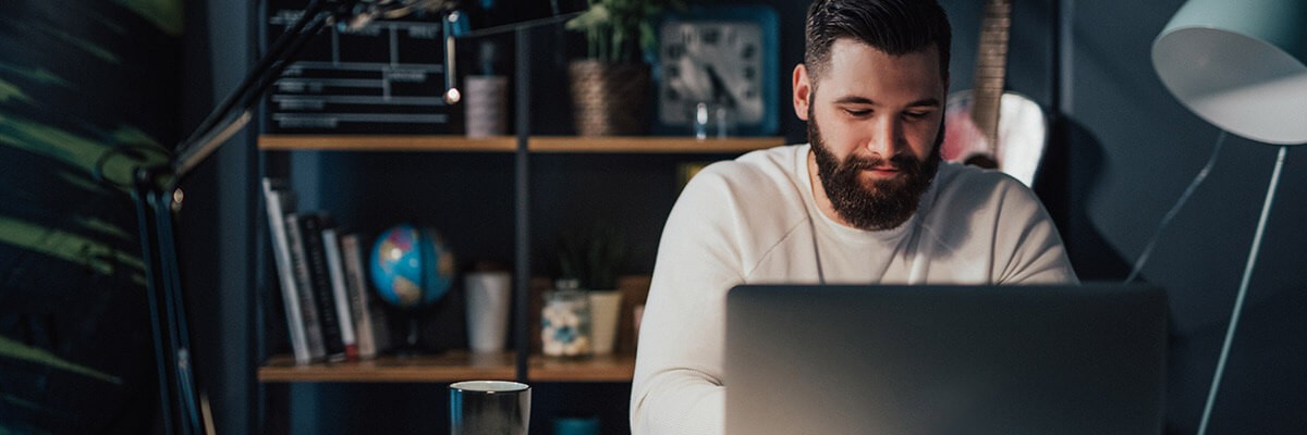 Man working on laptop remotely 