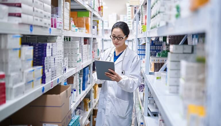 Picture of someone working at a pharmacy