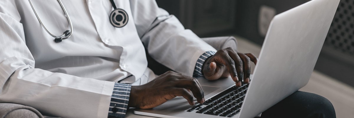 Retail merchandiser reviewing design concepts off Apple devices as they are working on store displays and visual concepts. 