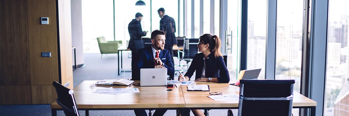 Law professionals talking at table. Trading firm, proprietary trading firm, Microsoft, Microsoft CSP, technology, technology systems, cloud, vendor relationship, technology solutions