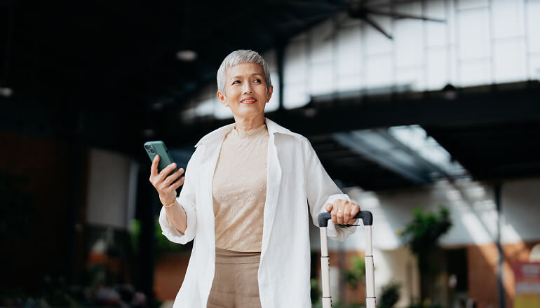 Tripadvisor seamlessly transitions to Google Workspace with Insight Services Girl holding phone with a suitcase