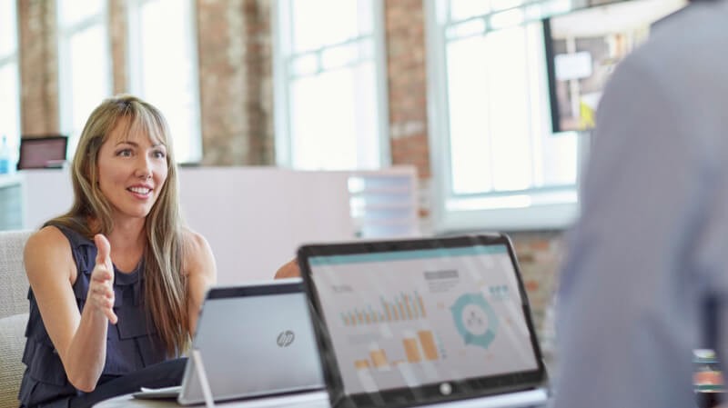 Discover the many ways Insight Managed Office and HP devices can help. business professionals have discussion near HP devices