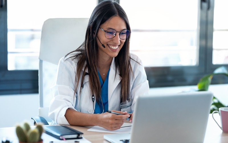 Doctor working on laptop device