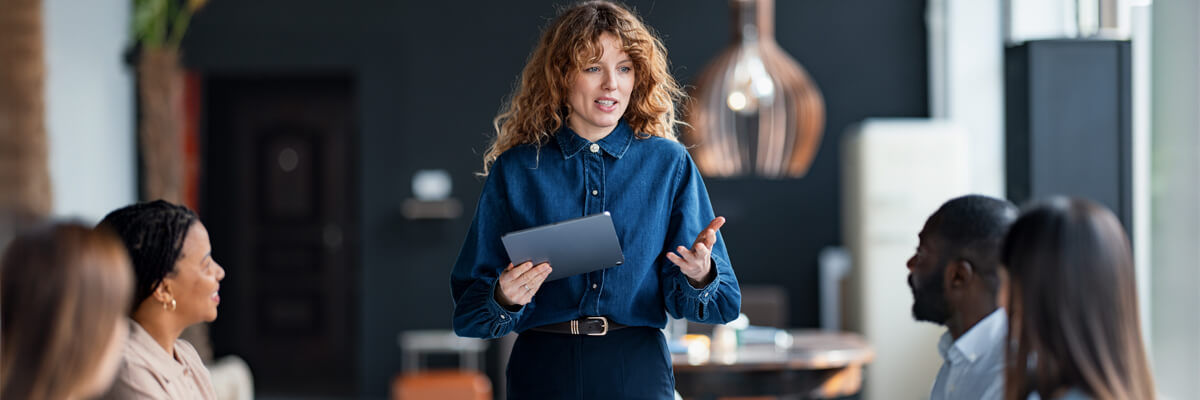 Business team attentively listens during a Radius analysis workshop discovery session, collaborating on insights.