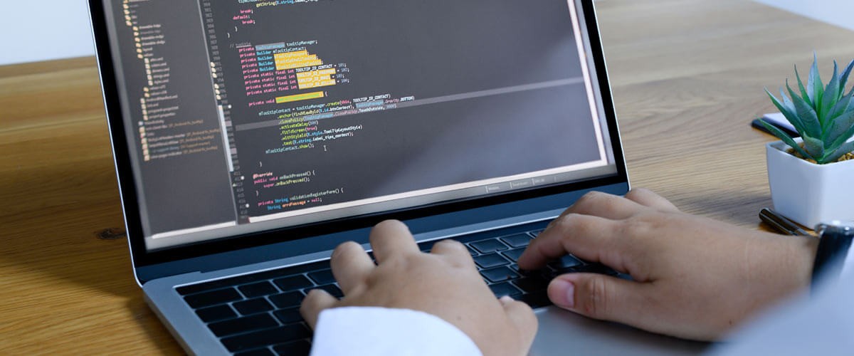 Developer coding out a web application. Agile and DevOps. Agile vs DevOps. Agile adoption. Agile approach. DevOps transformation. What’s next after Agile? Agile, DevOps, IT Infrastructure, programmer, coding