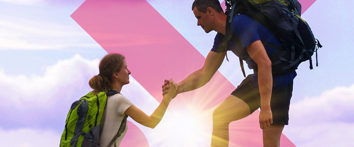 Hikers helping each other up a mountain. Automation, intelligent edge, artificial intelligence, IT priorities