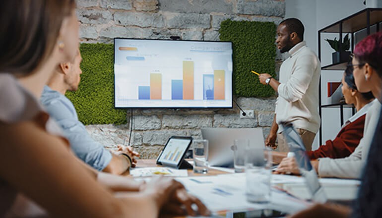 Work group having collaborative meeting. Thales, CipherTrust, data security, data management, data compliance