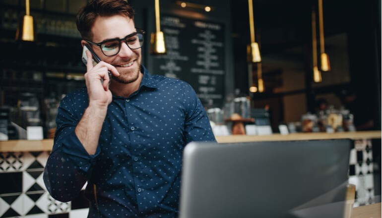 Getting Arizona Businesses Back to Work Safely Male employee using technology in store