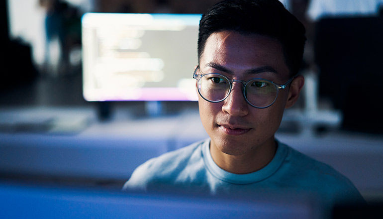 User working on monitor